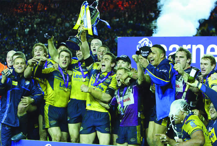 Leeds Rhinos team holding a trophy
