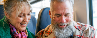 Happy couple on train